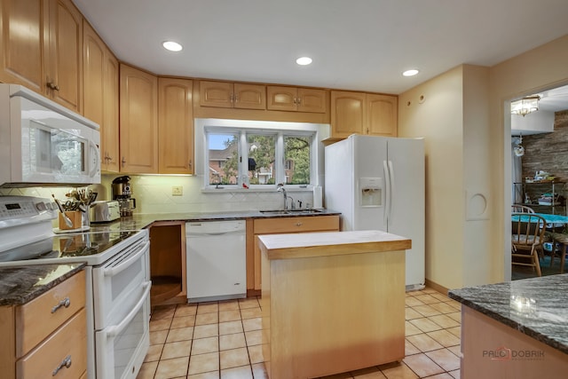 kitchen with decorative backsplash, white appliances, light tile patterned flooring, and a kitchen island