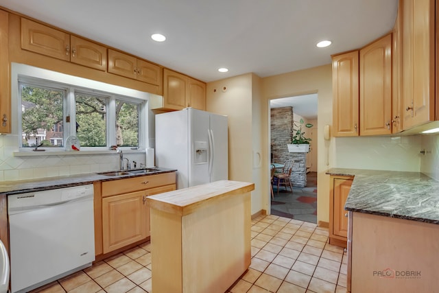 kitchen featuring light tile patterned flooring, sink, decorative backsplash, and white appliances