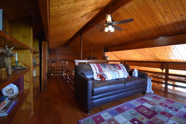 living area featuring lofted ceiling with beams, wood walls, hardwood / wood-style floors, ceiling fan, and wooden ceiling