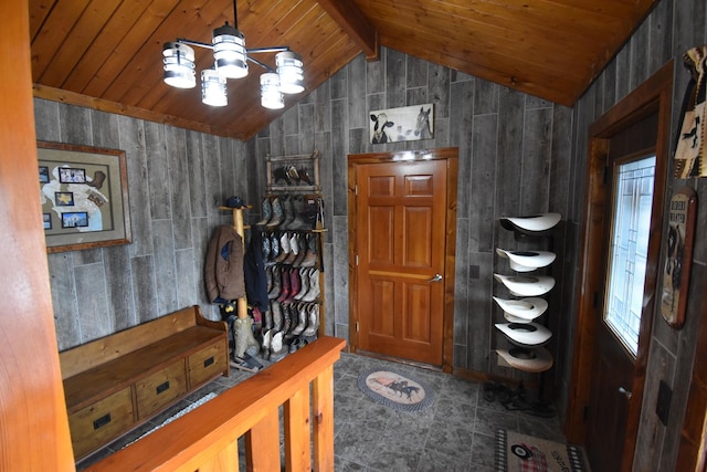 foyer entrance with wooden ceiling, wood walls, and vaulted ceiling