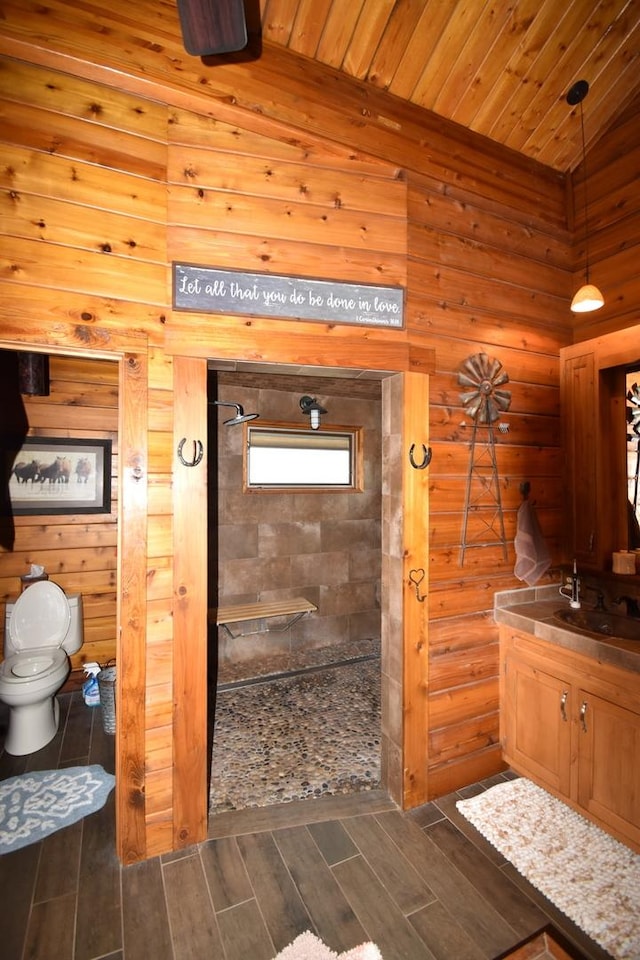 bathroom with walk in shower, toilet, wood ceiling, vanity, and wood finished floors