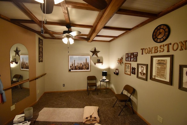 living area featuring baseboards, carpet flooring, a ceiling fan, beam ceiling, and coffered ceiling