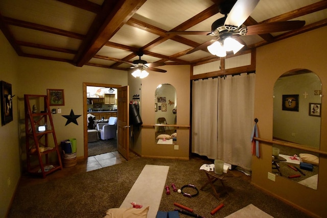 interior space with ceiling fan, carpet, arched walkways, coffered ceiling, and tile patterned floors