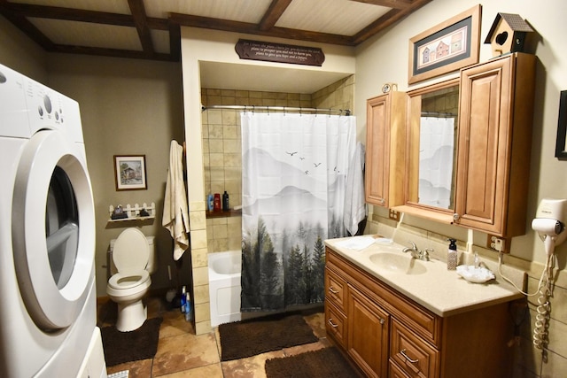 bathroom with vanity, shower / tub combo with curtain, toilet, washer / dryer, and beam ceiling