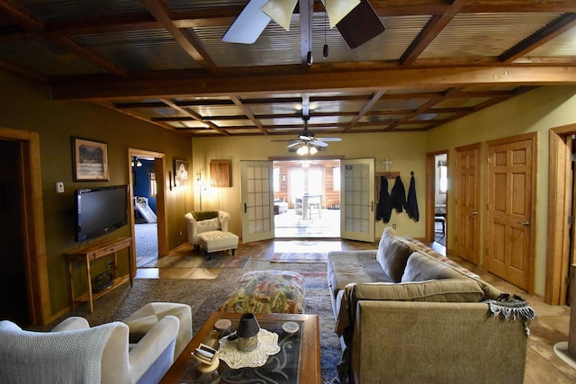 living area featuring beamed ceiling, coffered ceiling, and ceiling fan