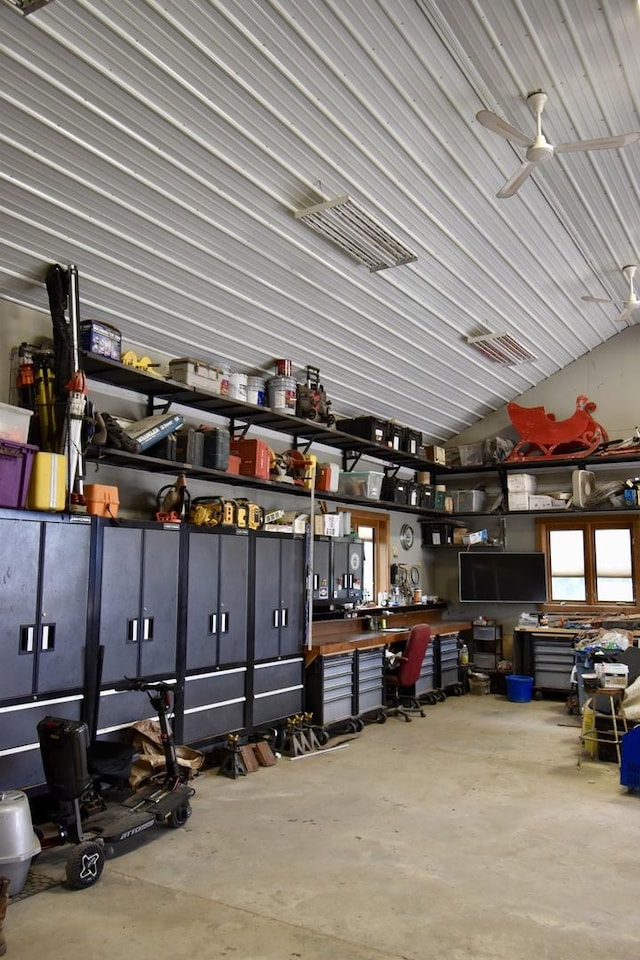 interior space featuring a workshop area and ceiling fan
