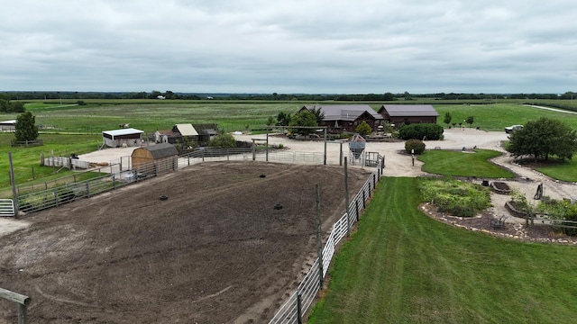 birds eye view of property with a rural view