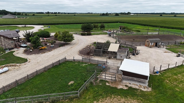 birds eye view of property with a rural view