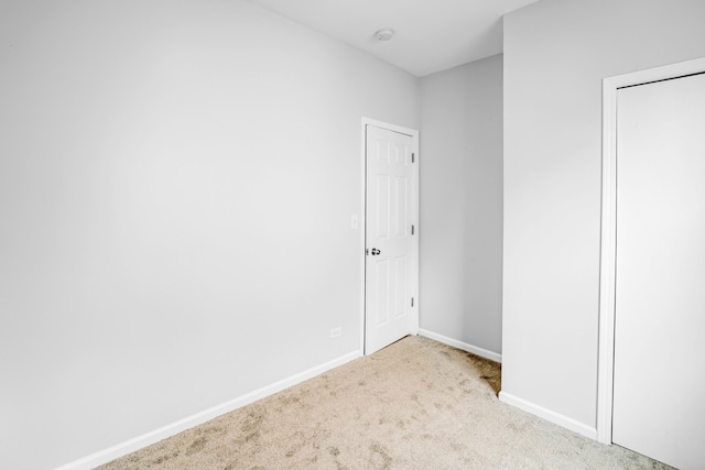 unfurnished bedroom with light carpet