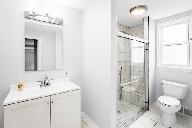 bathroom featuring tile patterned floors, walk in shower, vanity, and toilet