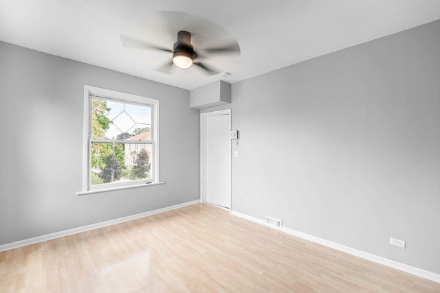 spare room featuring ceiling fan and light wood-type flooring