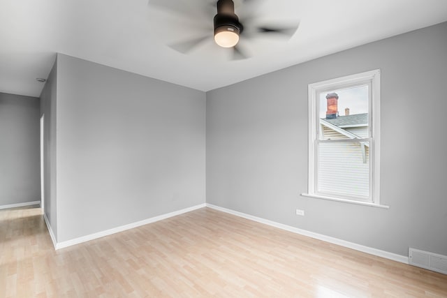 spare room featuring ceiling fan and wood-type flooring