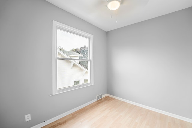 empty room featuring ceiling fan and wood-type flooring