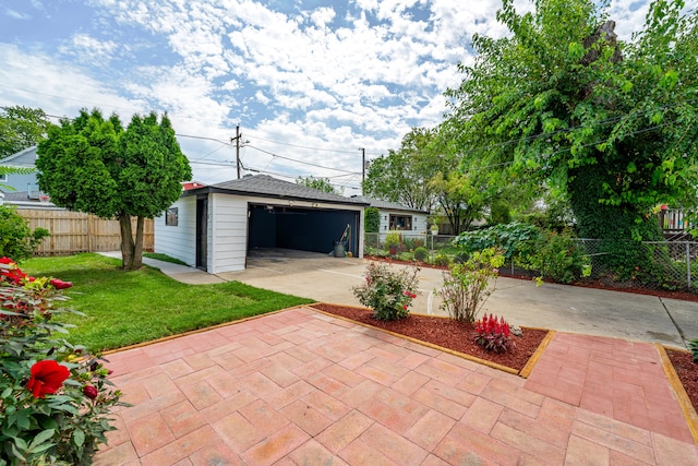 exterior space with a garage and an outdoor structure