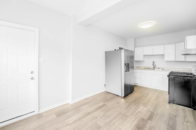 kitchen with stainless steel fridge with ice dispenser, white cabinets, sink, light hardwood / wood-style flooring, and range