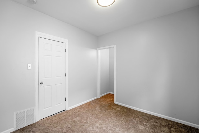 unfurnished bedroom with a closet and carpet floors