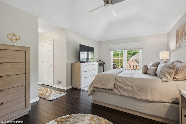 bedroom featuring dark wood-type flooring, ceiling fan, and lofted ceiling