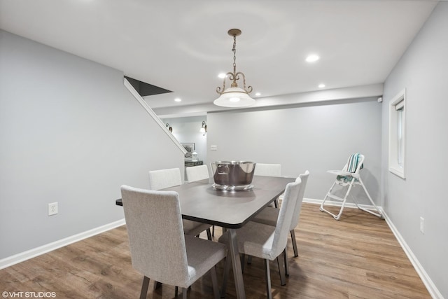 dining space featuring hardwood / wood-style flooring