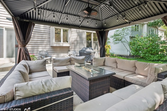 view of patio with a gazebo, grilling area, outdoor lounge area, and ceiling fan