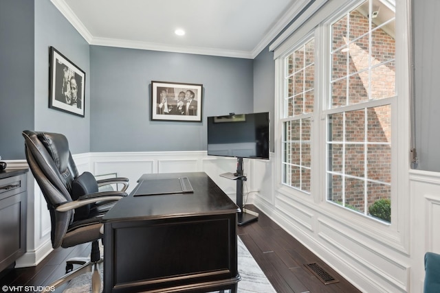 home office with dark wood-type flooring and ornamental molding