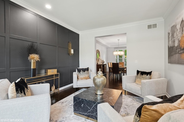 living room featuring crown molding and dark hardwood / wood-style floors