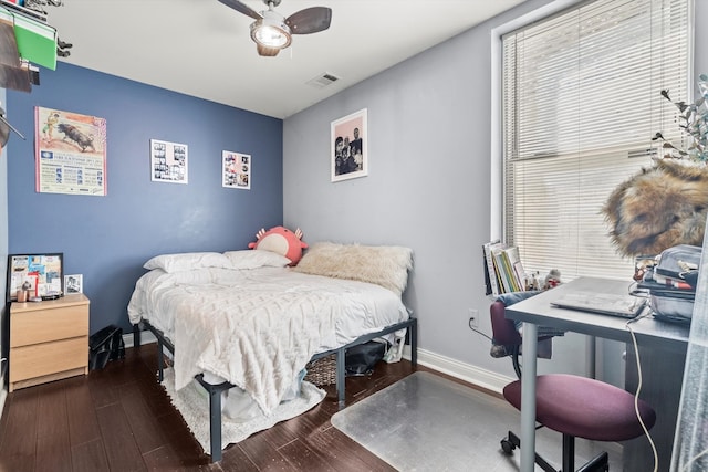 bedroom with ceiling fan and dark hardwood / wood-style floors