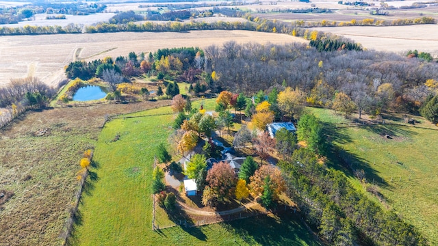 birds eye view of property featuring a water view and a rural view