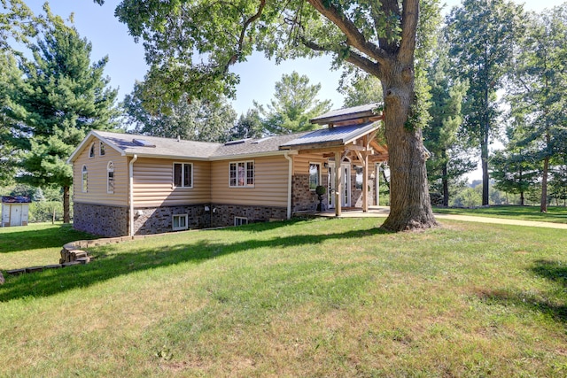 rear view of house with a yard