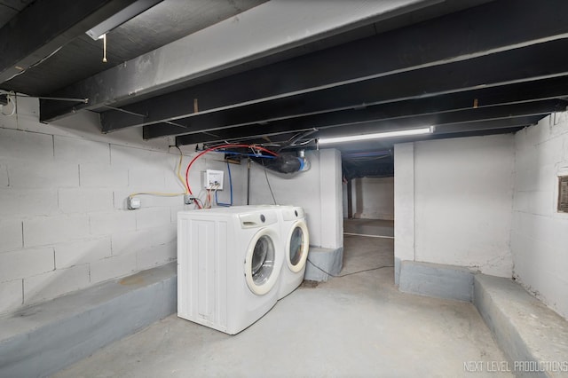 unfinished basement with washer and clothes dryer