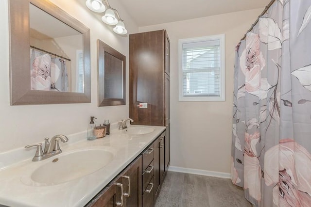 bathroom with wood-type flooring and vanity