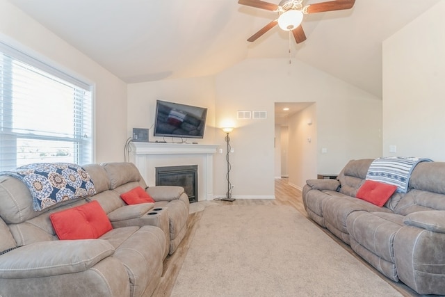 living room with vaulted ceiling and ceiling fan