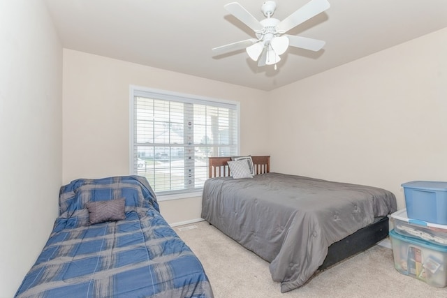 bedroom featuring ceiling fan and light colored carpet