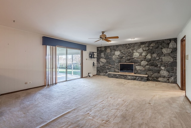 unfurnished living room with carpet flooring, a fireplace, and ceiling fan