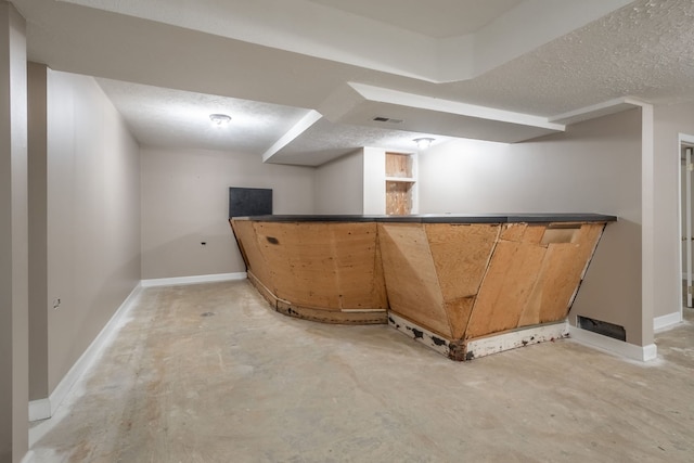 bar with a textured ceiling