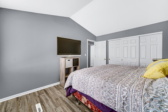 306 Hidden Creek Ln, North Aurora, IL 60542 - bedroom featuring vaulted ceiling, hardwood / wood-style flooring, and a closet