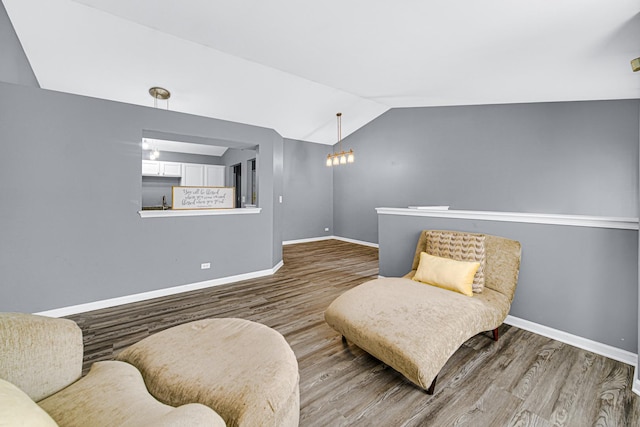 306 Hidden Creek Ln, North Aurora, IL 60542 - sitting room with a notable chandelier, vaulted ceiling, and wood-type flooring