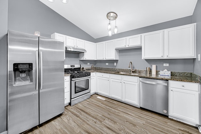 306 Hidden Creek Ln, North Aurora, IL 60542 - kitchen featuring dark stone counters, sink, light hardwood / wood-style flooring, vaulted ceiling, and stainless steel appliances