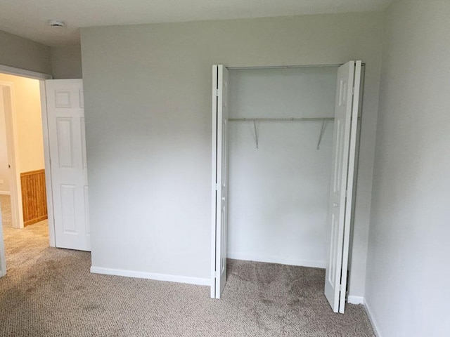 carpeted empty room featuring a wealth of natural light