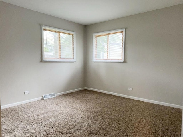 unfurnished bedroom with carpet and a closet