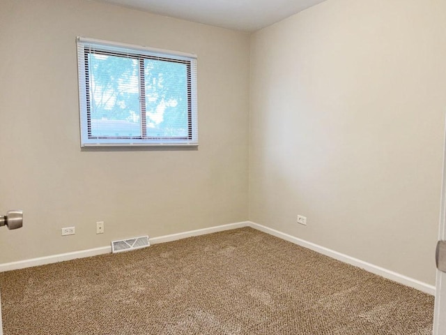 unfurnished bedroom with light colored carpet and a closet