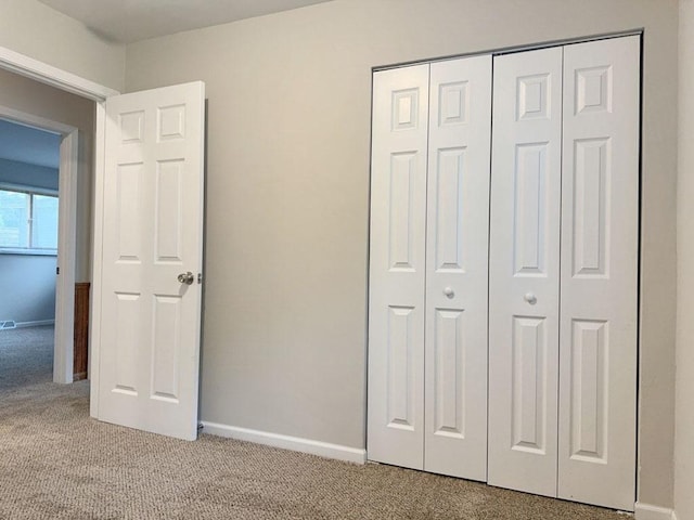 spare room featuring plenty of natural light and carpet floors