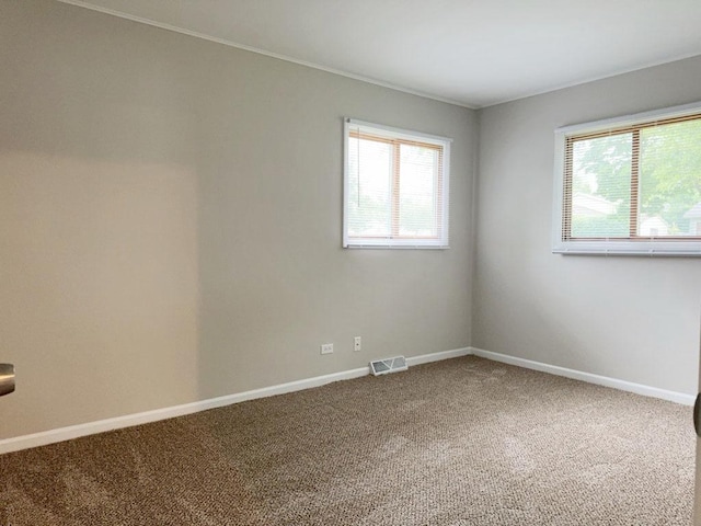 unfurnished bedroom with a closet and light colored carpet