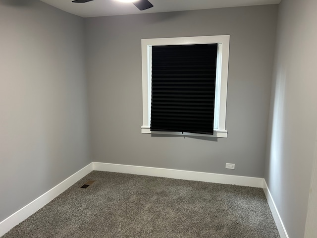 empty room featuring ceiling fan and carpet flooring