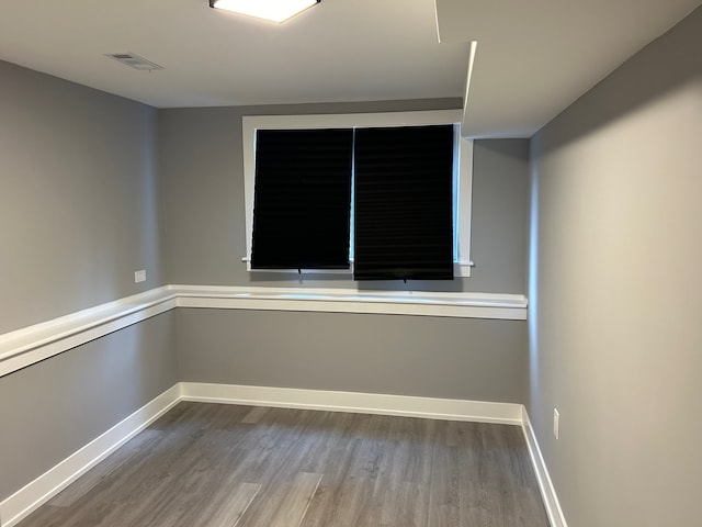 spare room with hardwood / wood-style floors