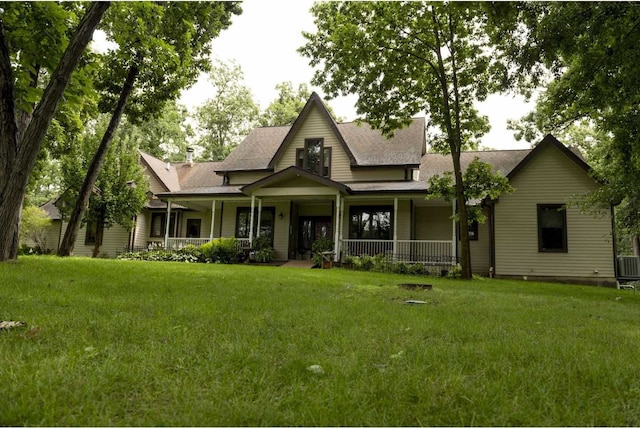 view of front of house with a front lawn and cooling unit