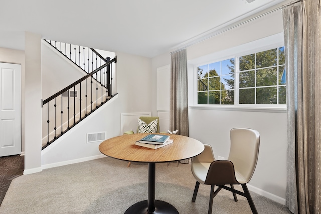 view of carpeted dining area