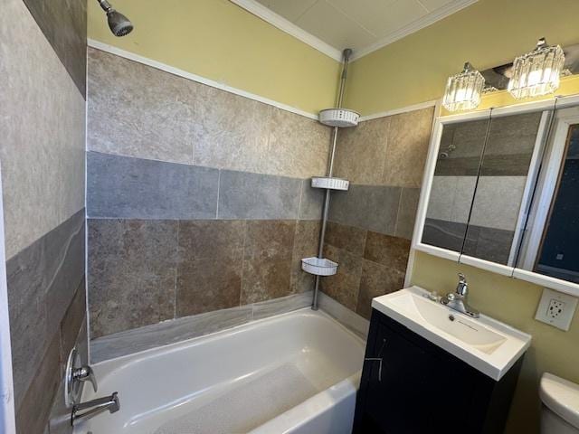 full bath featuring ornamental molding, bathing tub / shower combination, toilet, and vanity