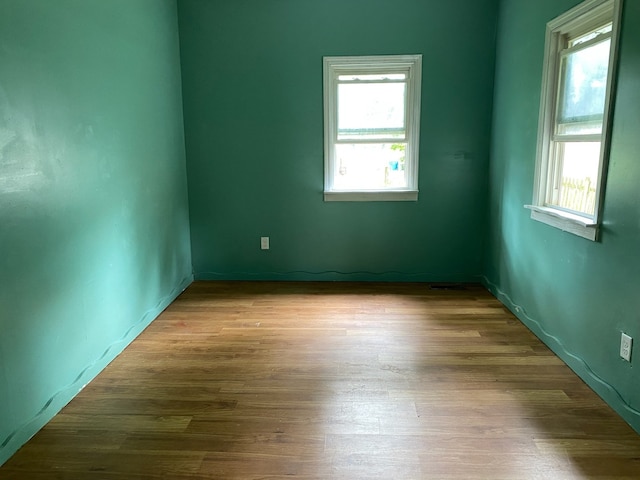 empty room featuring wood finished floors