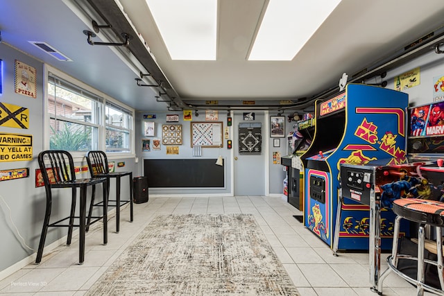 recreation room with light tile patterned floors