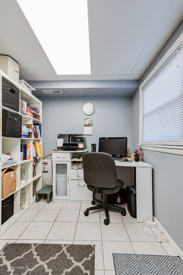 home office featuring light tile patterned floors